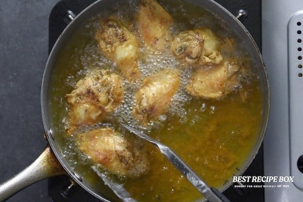 Chicken wings frying in oil