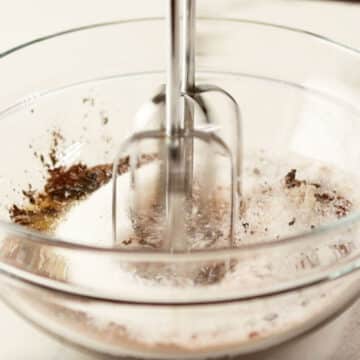 Ingredients being mixed in glass bowl.