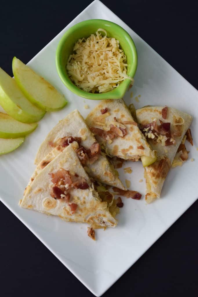 Overhead photo of Gouda Bacon Onion Apple Quesadillas on white plate