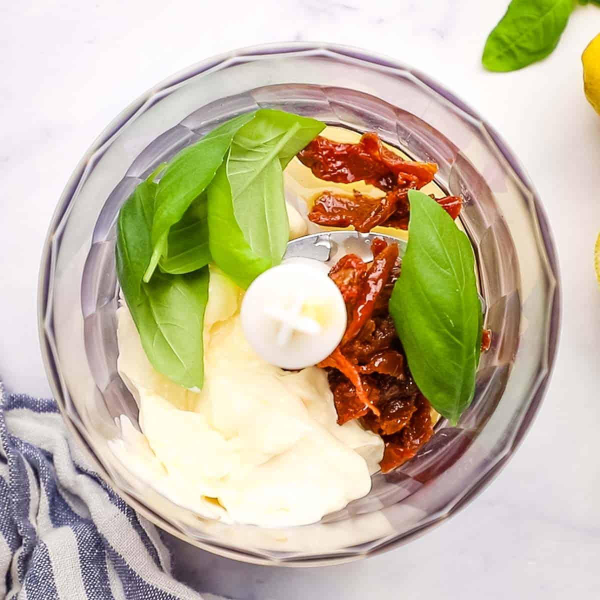 sun dried tomato aioli ingredients in a food processor
