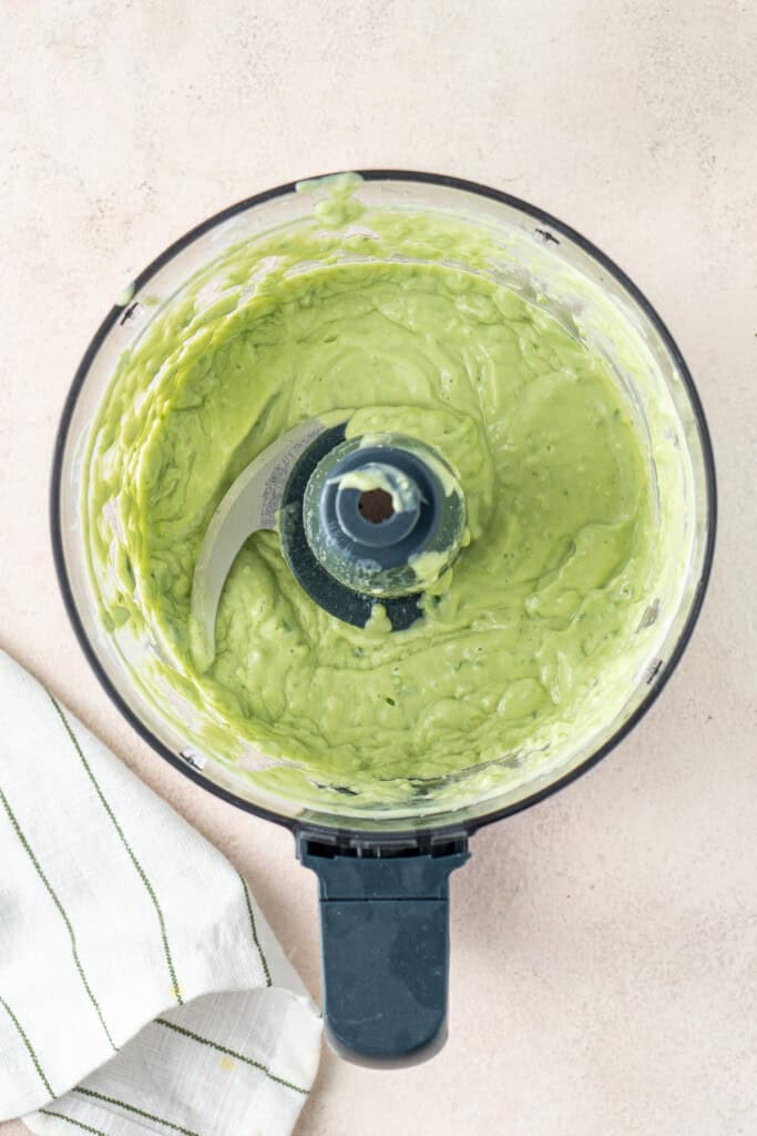 The avocado yoghurt sauce in a food processor.