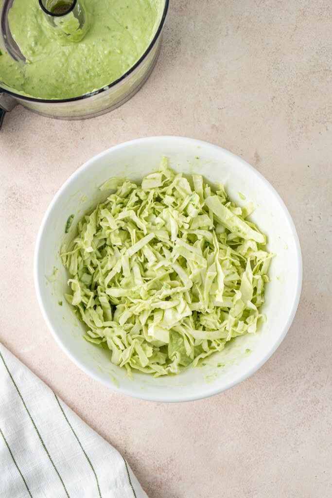 The shredded cabbage slaw in a bowl.