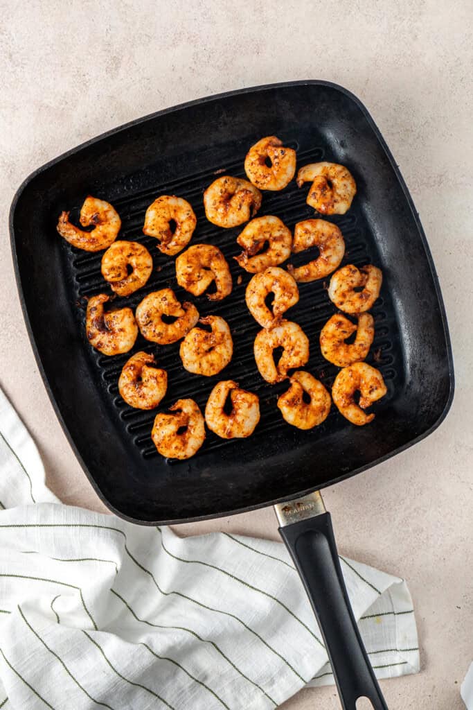 The cooked prawns on a grill pan.