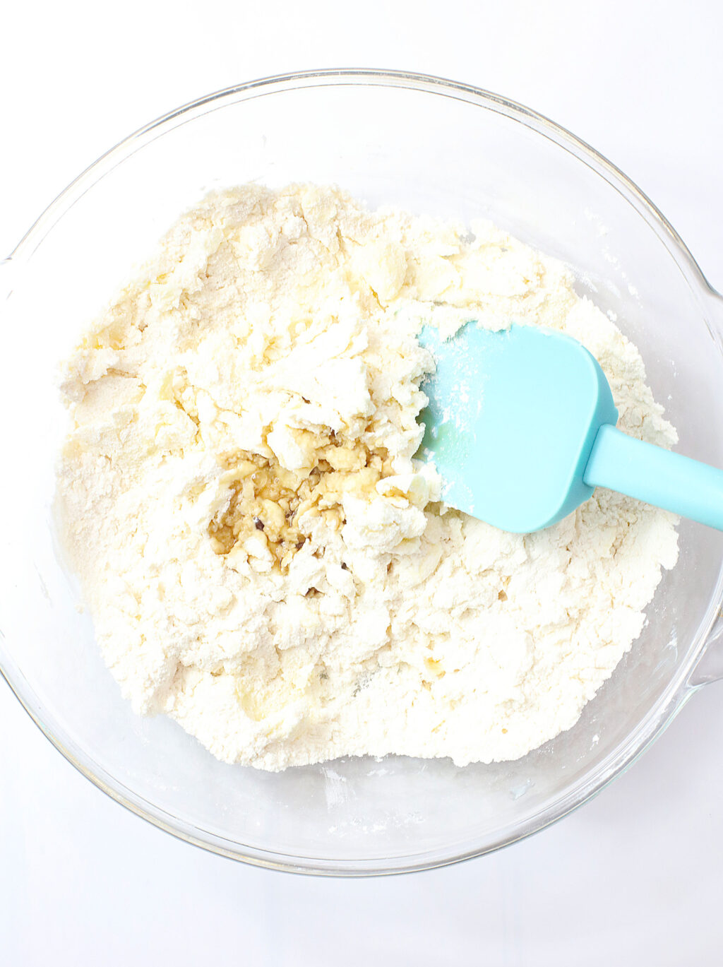 cookie dough ingredients in large clear bowl