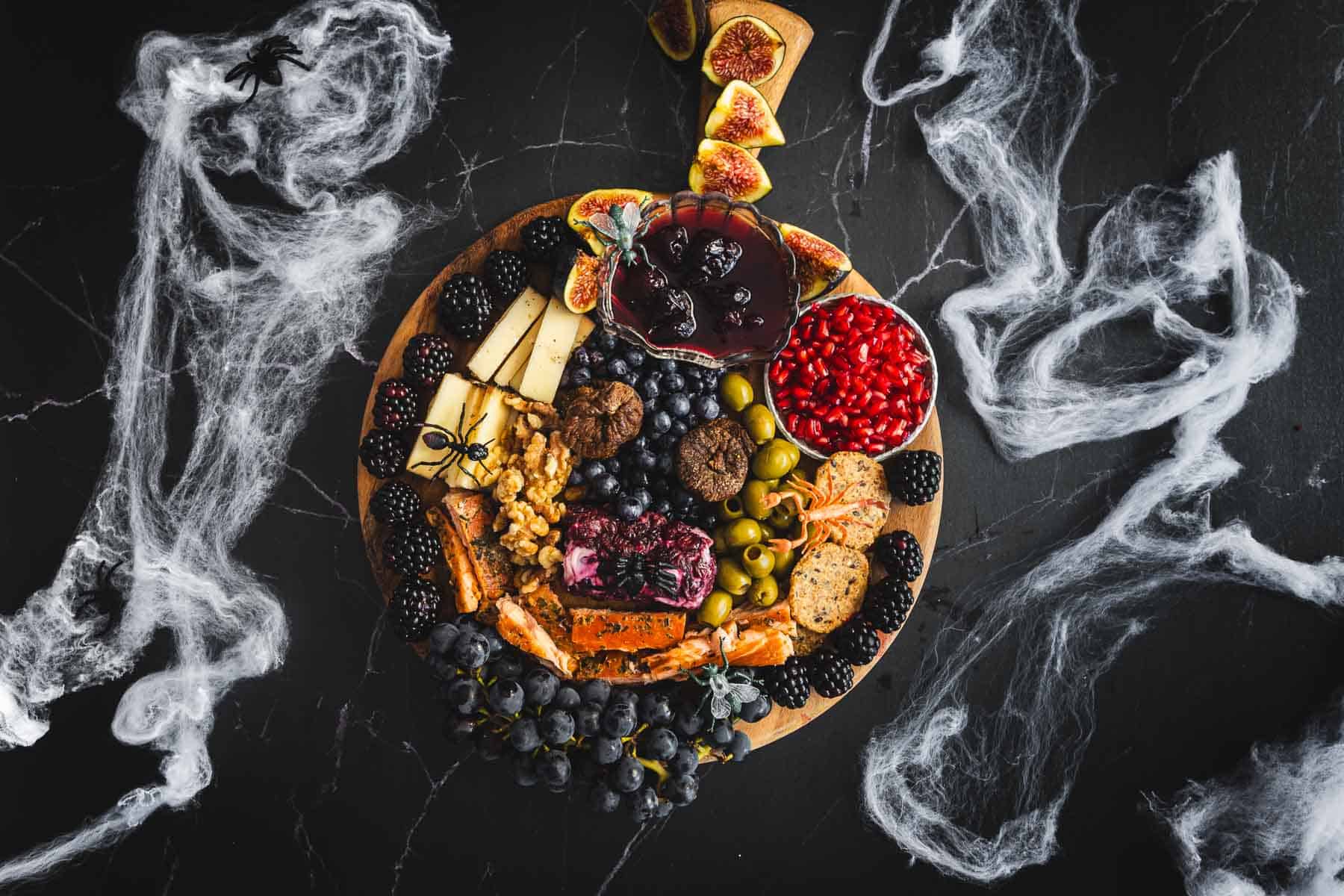 A plate of fruit and berries with smoke coming out of it.