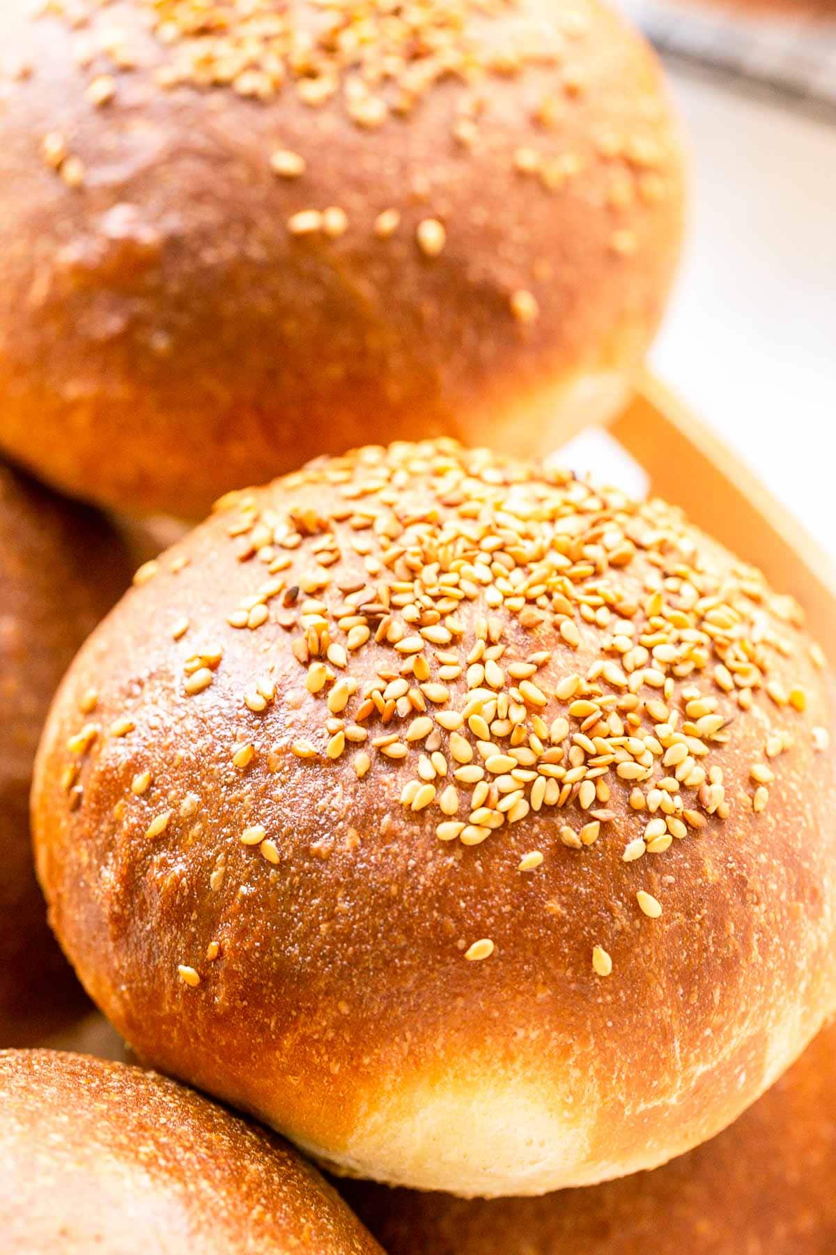 Want to try your hand at making homemade hamburger buns? Try this recipe and you have the best hamburger buns you ever tried. Slightly sweet with a golden crust. Bake in a hot oven and brush with melted butter.