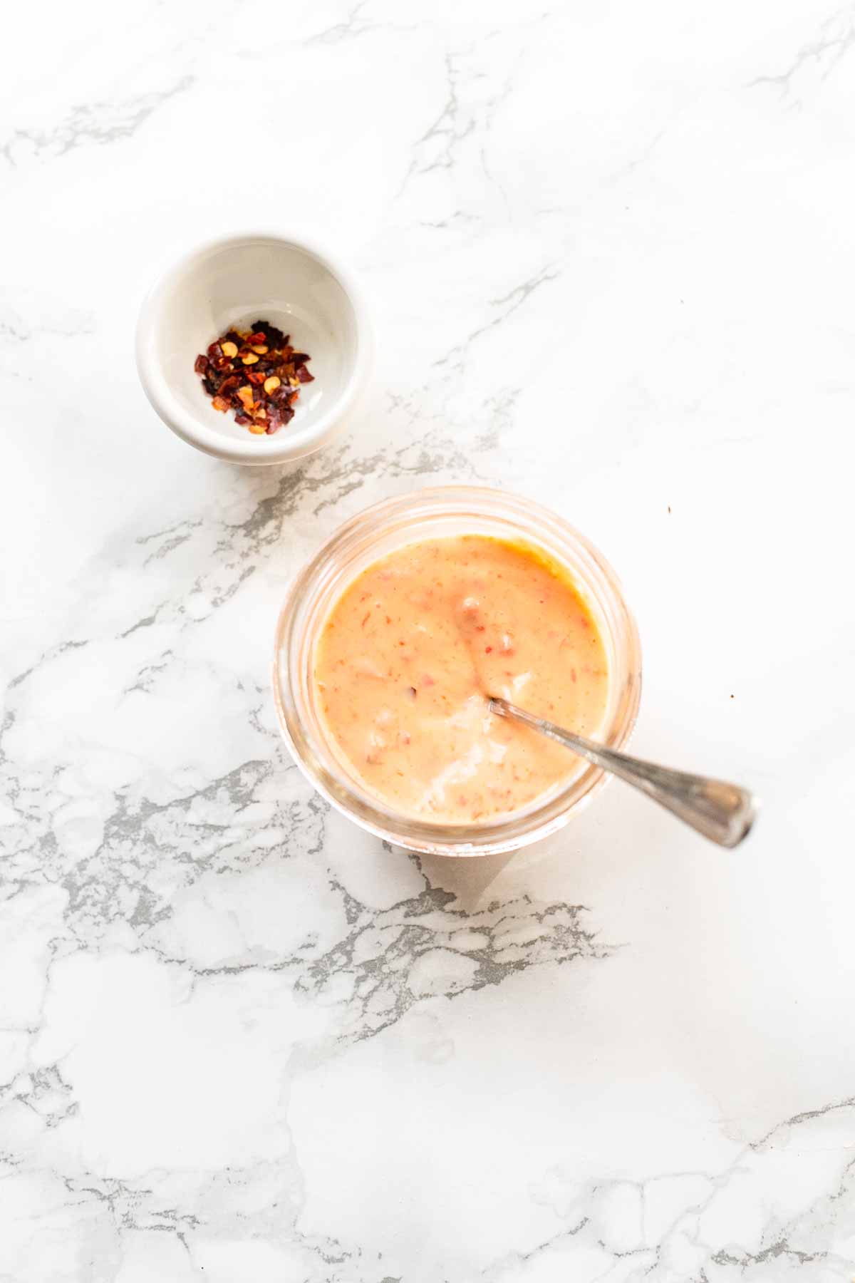 Want to make the best burger sauce? Try this recipe. It is super easy and contains only 3 ingredients. Put it on your favorite burger, you will love it! It is slightly spicy but you can control how hot you can make it. This sauce is made with mayonnaise but can easily be adjusted to a lower-calorie sauce.