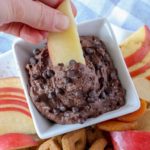 Apples dipped in chocolate brownie batter dip