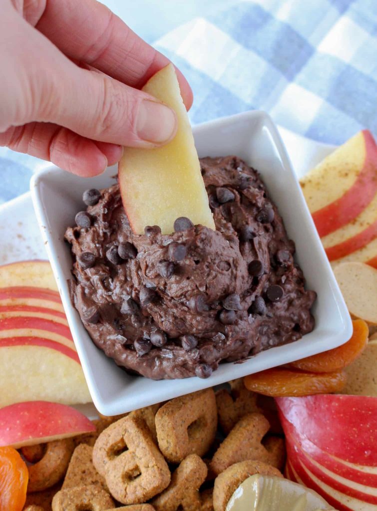 Apples dipped in chocolate brownie batter dip