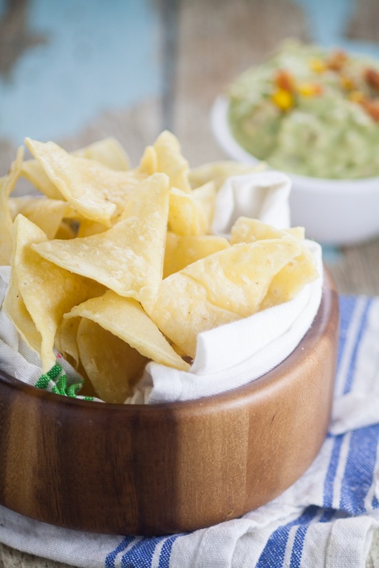 Homemade Corn Tortilla Chips are easy to make! A simple recipe to make your own Homemade Corn Tortilla Chips that are absolutely delicious.  Store bought tortilla chips just can't compete with these crunchy fresh ones!