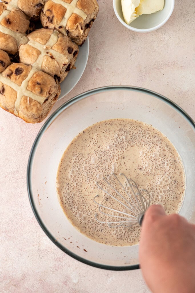 Whisking together the dairy free custard mixture in a bowl.