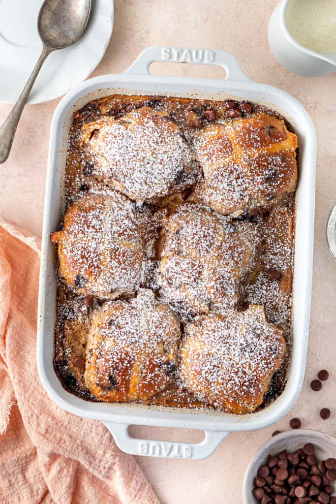 The finished hot cross bun bread and butter pudding with icing sugar.