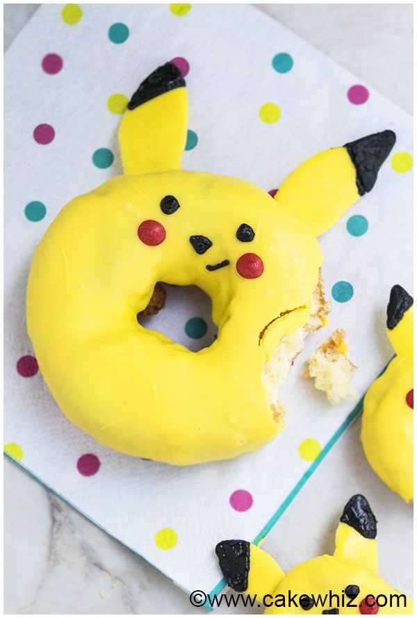 Partially Eaten Eaten Yellow Donuts With Crumbs. 