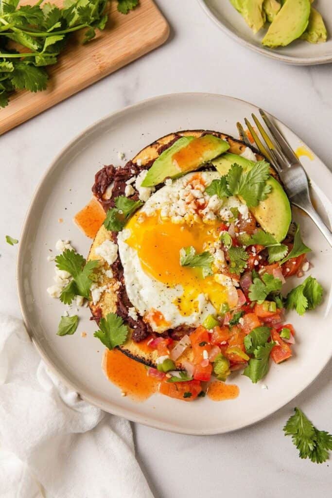 healthy huevos rancheros with a sunny side up egg
