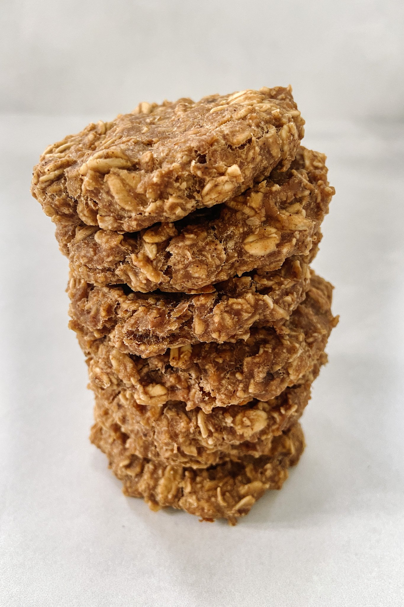 Peanut butter cookies stacked one on top of the other