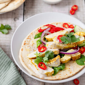 Indian chicken wrap on a plate