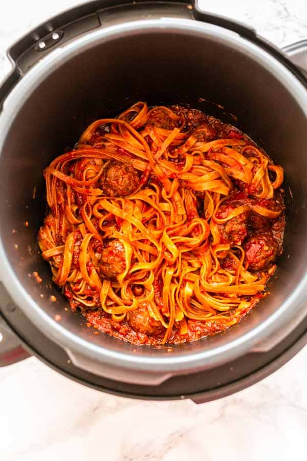 Instant Pot pasta and meatballs is a super easy and delicious dinner recipe. You can add your pasta to readymade meatballs and sauce or make it from scratch.