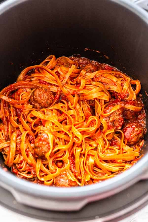 Instant Pot pasta and meatballs is a super easy and delicious dinner recipe. You can add your pasta to readymade meatballs and sauce or make it from scratch.