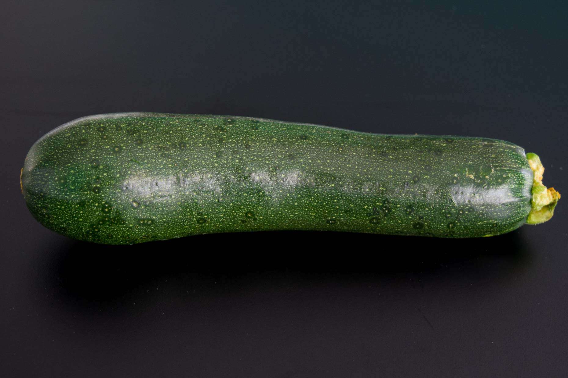 Zucchini on black background 