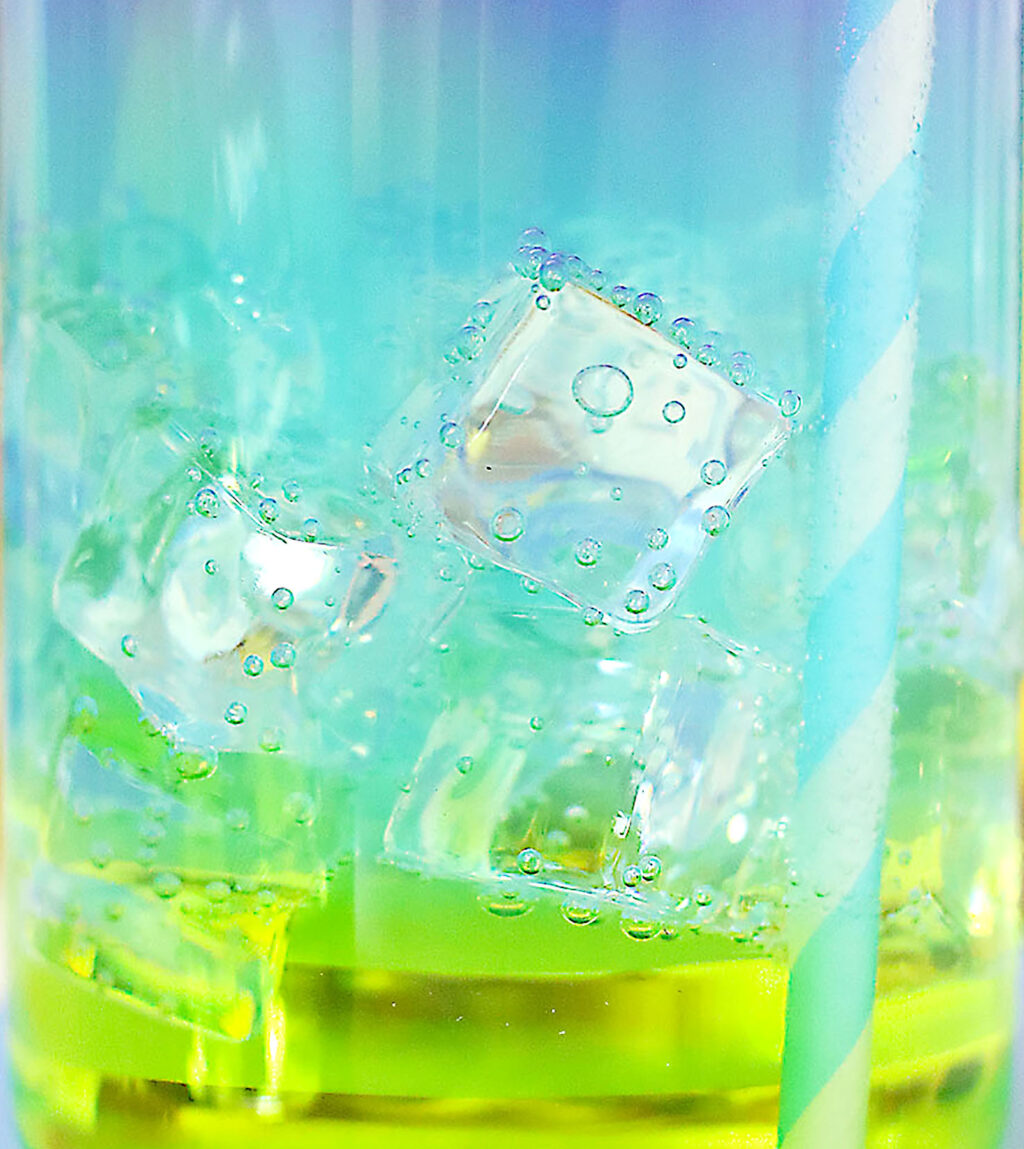 upclose of ice cubes inside the mermaid cocktail drink