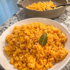 A white bowl filled with Mexican rice.