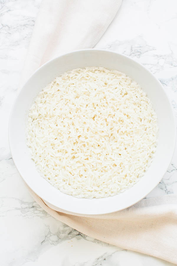 White bowl with basmati rice cooked in a microwave.