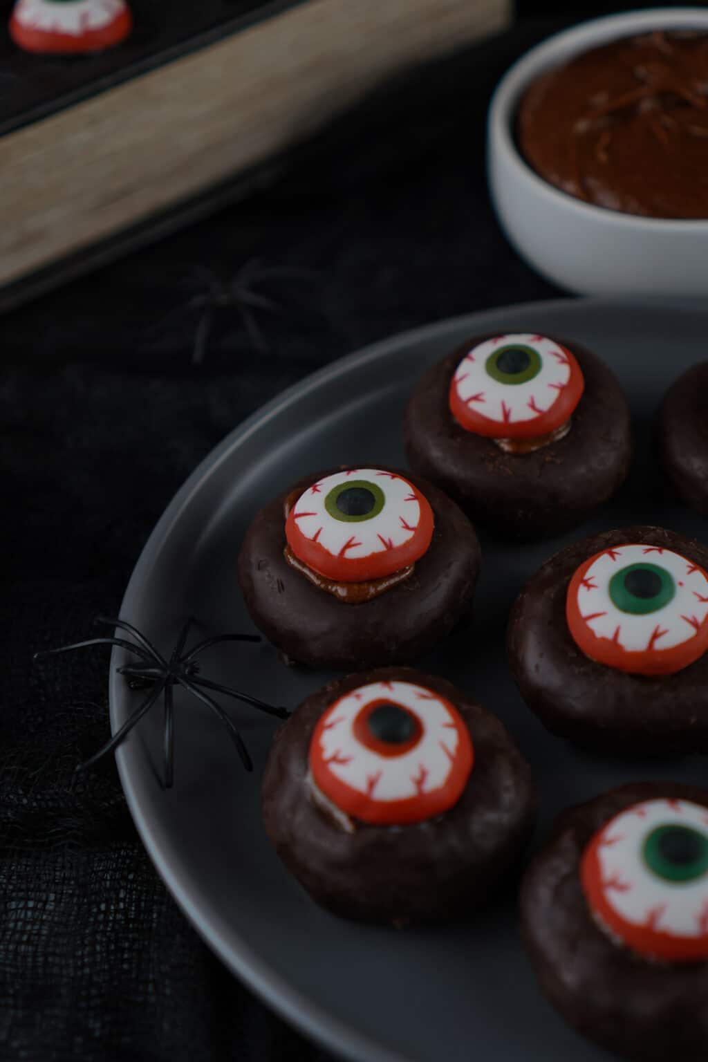 side view of mini eyeball donuts on plate