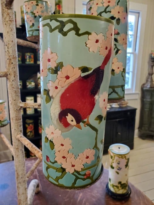 candle with a bird and flowers engraved in it