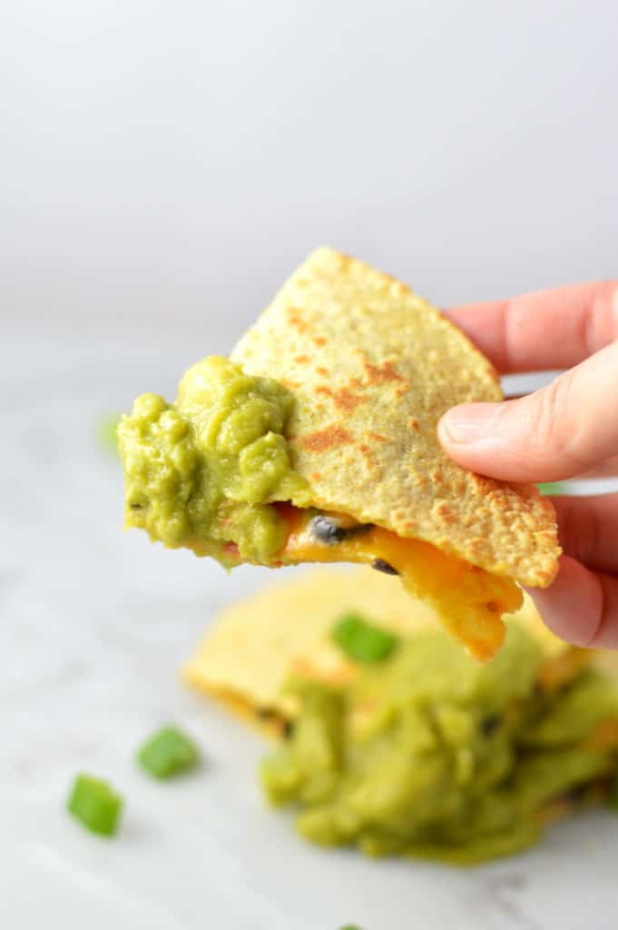 quesadilla dipped in guacamole