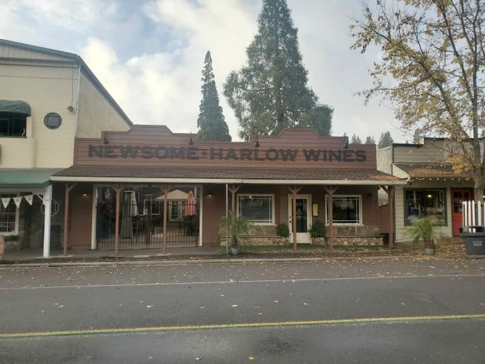 Newsome Harlow Wines sign on a brown building 