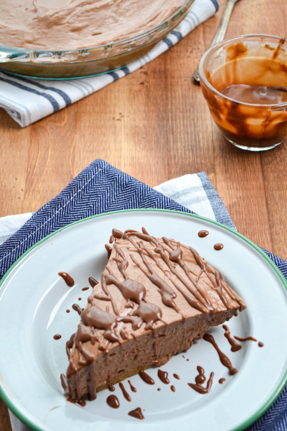 A slice of nutella pie, drizzled with nutella ganache.