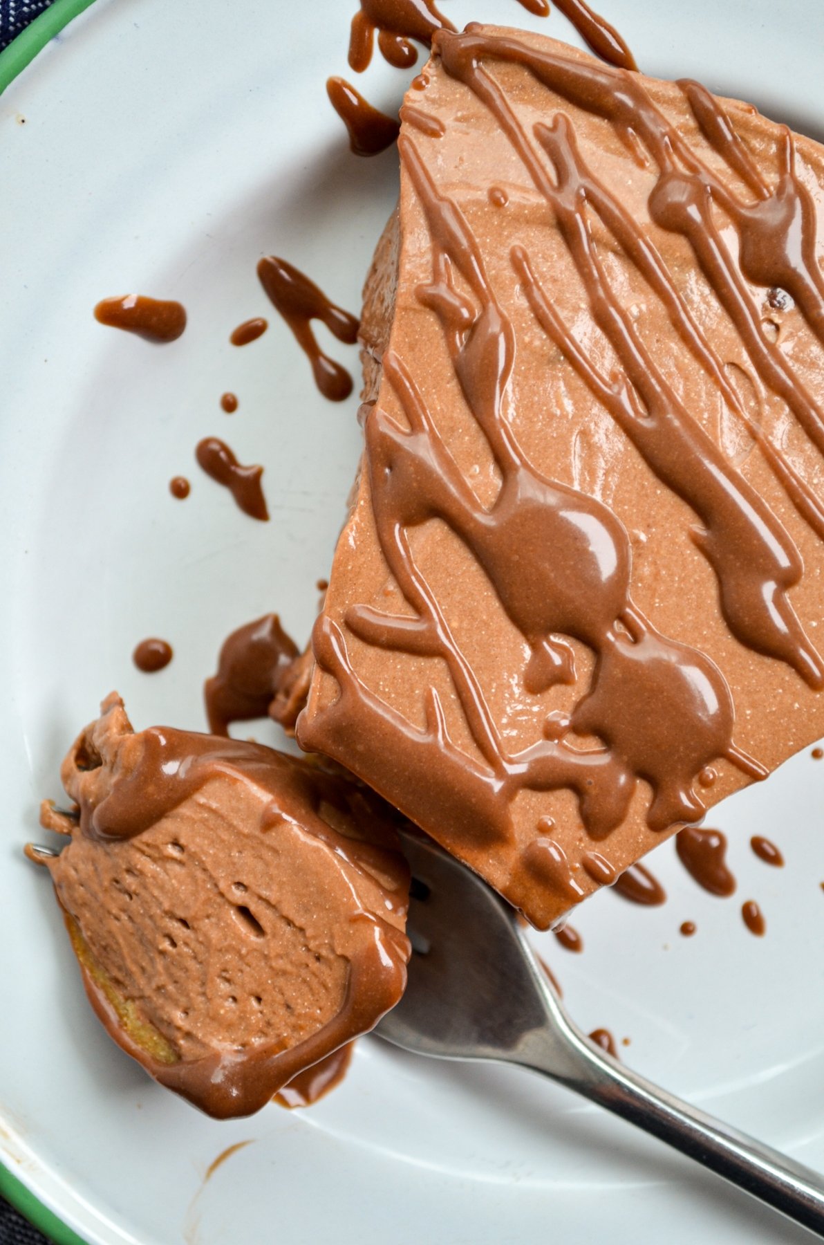 A slice of nutella pie, drizzled with nutella ganache.