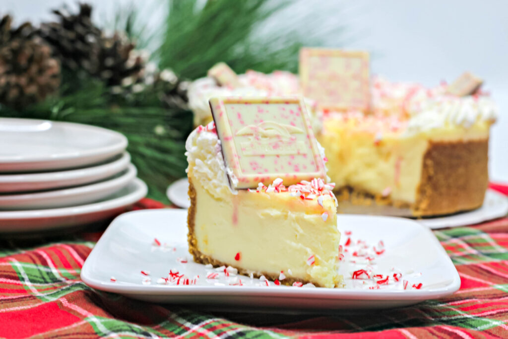 small slice of white chocolate peppermint cheesecake on a plate