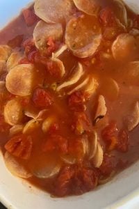 Pizza Potatoes is a pizza scalloped potatoes recipe with a box of scalloped potatoes, pepperoni, canned, diced tomatoes and shredded cheese.