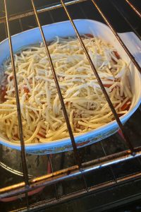 Pizza Potatoes is a pizza scalloped potatoes recipe with a box of scalloped potatoes, pepperoni, canned, diced tomatoes and shredded cheese.