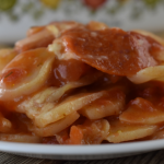 Pizza Potatoes is a pizza scalloped potatoes recipe with a box of scalloped potatoes, pepperoni, canned, diced tomatoes and shredded cheese.