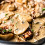 The best pork chops with mushroom sauce. This recipe is a true bistro recipe and fast to prepare. It is on the table in no time. It has the most tasty mushroom garlic bacon sauce. These pork chops will rapidly become your new favorite dinner recipe. Want to try visit fastfoodbistro.com for the full recipe #fastfoodbistro #porkchopswithmushroomsauce #porkchoprecipe #porkchops #mushroomgarlicbaconporkchops #dinner