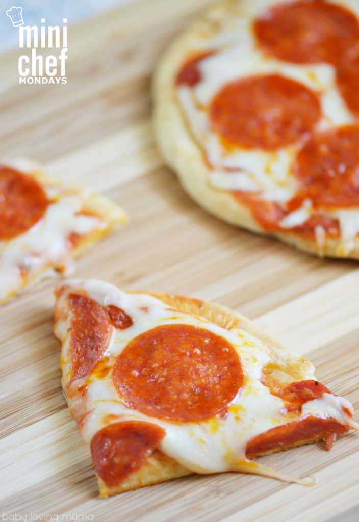sliced flatbread pizza on cutting board