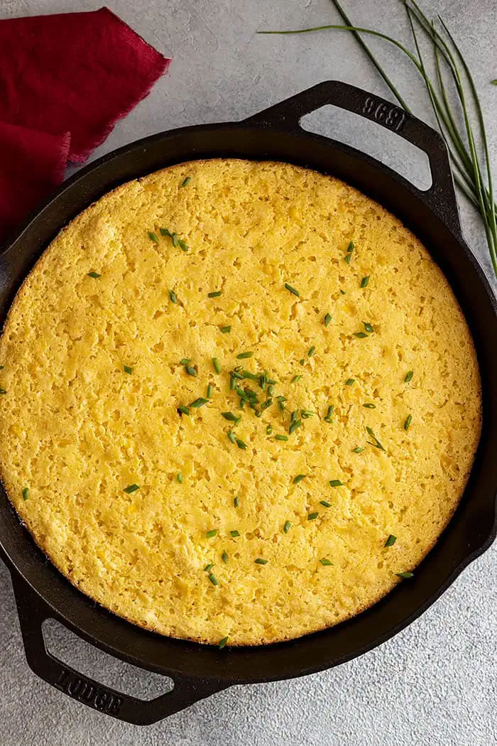 overhead: my recipe for cornbread casserole fresh from the oven garnished with chopped chives