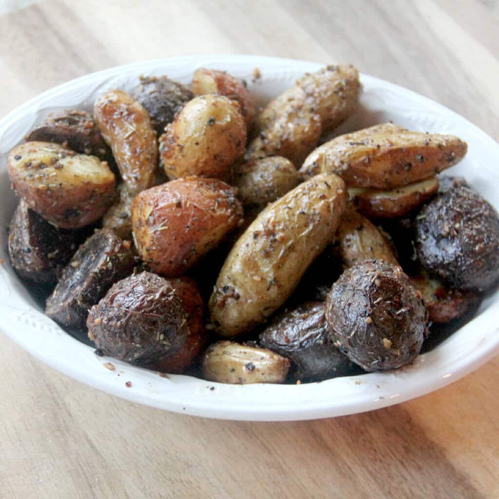 Roasted baby potatoes with garlic and Italian herbs are crispy on the outside and soft and fluffy on the inside. Easy to make!