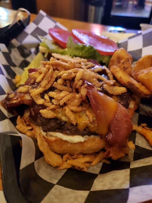 burger with fried onions and fries