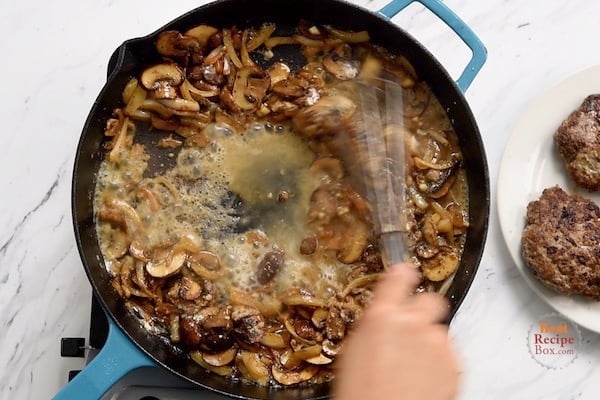 Whisking in flour and a little broth to the onions and mushrooms