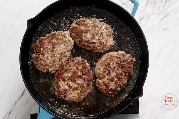 Seared beef patties in a skillet