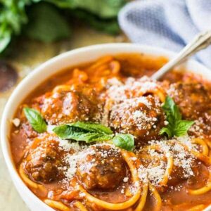 This Slow Cooker Spaghetti Meatball Soup is pure comfort food! A wonderful tomato soup filled with flavorful meatballs and tender spaghetti! | www.countrysidecravings.com