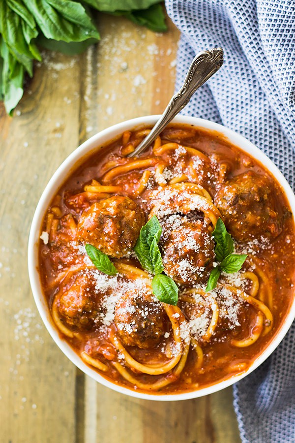 This Slow Cooker Spaghetti Meatball Soup is pure comfort food! A wonderful tomato soup filled with flavorful meatballs and tender spaghetti! | www.countrysidecravings.com