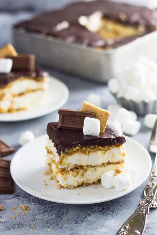 An easy S'mores Ice Box Cake recipe made with graham crackers, marshmallow filling and topped with chocolate ganache! | www.countrysidecravings.com