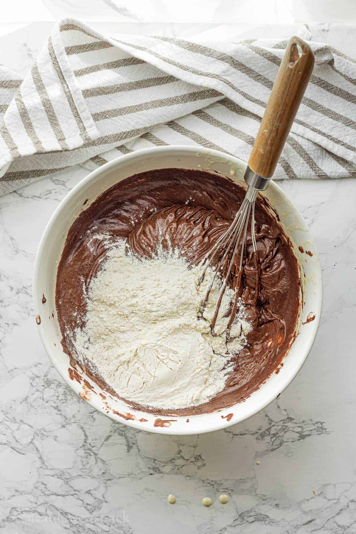 Flour and salt in brownie batter mixture.