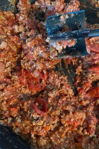 This family-pleasing Spaghetti Pie recipe features ground beef and staple pantries such as stewed tomatoes, tomato paste and spaghetti for the ultimate dinner. Interested in doing some freezer meals? Assemble this spaghetti pie, cover with foil and put in the freezer for easy weeknight meal prep.