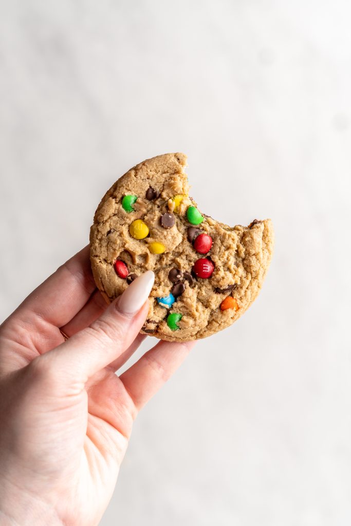 Peanut free monster cookie with bite taken out.