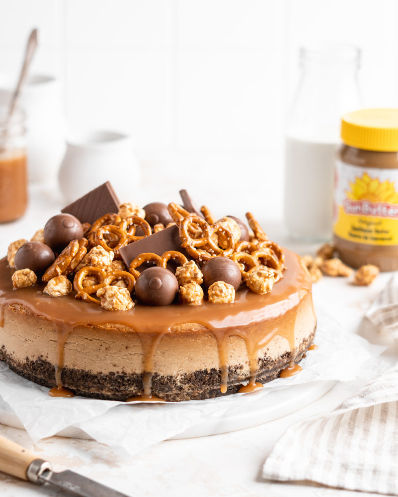 SunButter Cheesecake features a chocolate pretzel crust and is topped with a salted caramel sauce